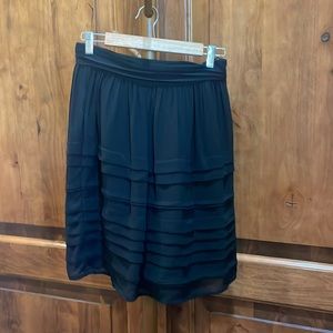 H&M black knee length skirt with lining.